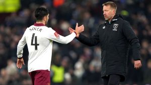 West Ham United manager Graham Potter, right, shake hands with player Carlos Soler after the English FA Cup third round soccer match against Aston Villa at Villa Park in Birmingham, England, Friday, Jan. 10, 2025. (Joe Giddens/PA via AP)