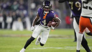 Baltimore Ravens wide receiver Zay Flowers runs with the ball during the first half of an NFL game against the Cleveland Browns Saturday, Jan. 4, 2025, in Baltimore. (AP/Stephanie Scarbrough)