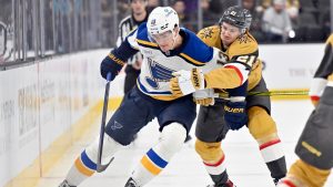 St. Louis Blues right wing Alexey Toropchenko (13) and Vegas Golden Knights centre Brett Howden (21) battle for the puck during the first period of an NHL hockey game, Monday, Jan. 20, 2025, in Las Vegas. (David Becker/AP)