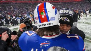 Buffalo Bills quarterback Josh Allen (17) and Baltimore Ravens quarterback Lamar Jackson (8) talk on the field after playing in an NFL divisional playoff football game, Sunday, Jan. 19, 2025, in Orchard Park, N.Y. (Gene J. Puskar/AP Photo)