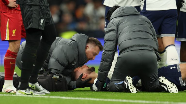 Tottenham's Rodrigo Bentancur receives medical treatment during the English League Cup semi final first leg soccer match between Tottenham and Liverpool, at the Tottenham Hotspur Stadium in London, Wednesday, Jan. 8, 2025. (Ian Walton/AP)