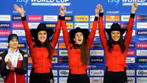 Canadian speed skaters Beatrice Lamarche, left to right, Ivanie Blondin and Carolina Hiller celebrate their gold medal win in the women’s team sprint event at the ISU World Cup Speed Skating in Calgary, Alta., Sunday, Jan. 26, 2025. (Todd Korol/CP)