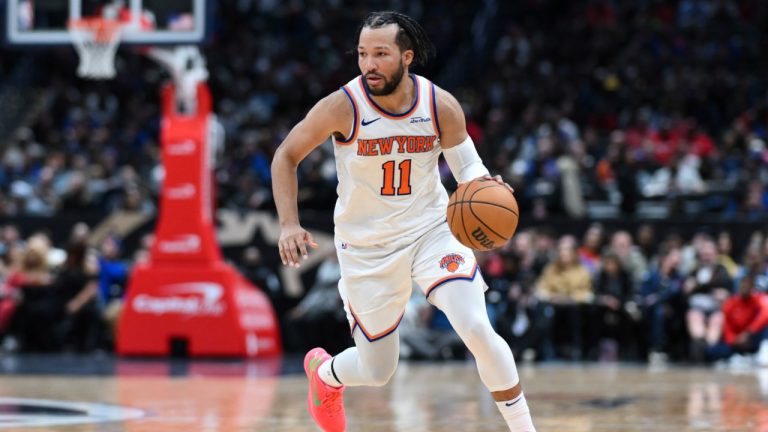 New York Knicks guard Jalen Brunson (11) handles the ball during overtime of an NBA basketball game against the Washington Wizards, Saturday, Dec. 28, 2024, in Washington. (Terrance Williams/AP)