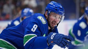 Vancouver Canucks' J.T. Miller gives directions to Carson Soucy, not seen, as he prepares to take a faceoff during the second period of an NHL hockey game against the Florida Panthers, in Vancouver, B.C., Thursday, Dec. 12, 2024. (Darryl Dyck/CP)