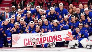 United States players pose for a group photo with the trophy following their IIHF World Junior Hockey Championship gold medal game win over Finland, in Ottawa, Sunday, Jan. 5, 2025. (Sean Kilpatrick/CP)