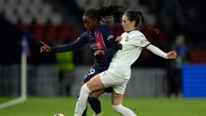 Hacken's Clarissa Larisey vies for the ball with PSG's Manssita Traore, left, during the women's Champions League quarterfinals, second leg, soccer match between Paris Saint-Germain and BK Hacken at Parc des Princes, in Paris, Thursday, March 28, 2024. (Thibault Camus/AP)