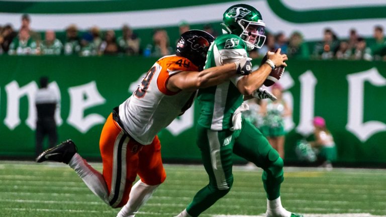 BC Lions defensive lineman Tibo Debaillie (49) tackles quarterback Cody Fajardo (7) during the third quarter of CFL football action in Regina, on Friday, July 29, 2022. (Heywood Yu/CP)