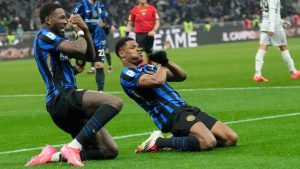 Inter Milan's Denzel Dumfries, right, celebrates after scoring his side's second goal with Marcus Thuram during the Serie A soccer match between Inter Milan and Empoli at the San Siro stadium in Milan, Italy, Sunday, Jan. 19, 2025. (Luca Bruno/AP)