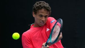 Gabriel Diallo of Canada plays a backhand return to Karen Khachanov of Russia during their second round match at the Australian Open tennis championship in Melbourne, Australia, Thursday, Jan. 16, 2025. (Manish Swarup/AP)