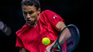 Canada's Gabriel Diallo returns the ball against Germany's Daniel Altmaier during a Davis Cup quarterfinal match at the Martin Carpena Sports Hall, in Malaga, southern Spain, on Wednesday, Nov. 20, 2024. (Manu Fernandez/AP)