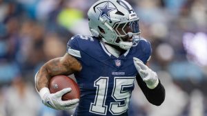 Dallas Cowboys running back Ezekiel Elliott (15) plays during an NFL football game between the Carolina Panthers and the Dallas Cowboys on Sunday, Dec. 15, 2024, in Charlotte, N.C. (Jacob Kupferman/AP)