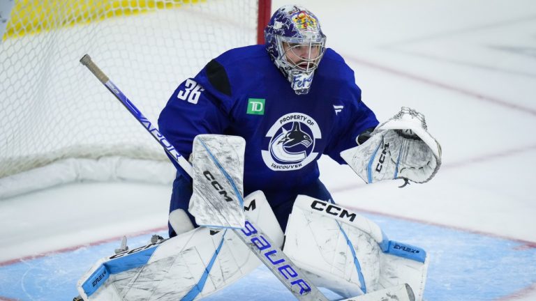 Goalie Dylan Ferguson, then with the Vancouver Canucks, prepares to make a save during the opening day of the NHL hockey team's training camp, in Penticton, B.C., on Thursday, September 19, 2024. (Darryl Dyck/CP)