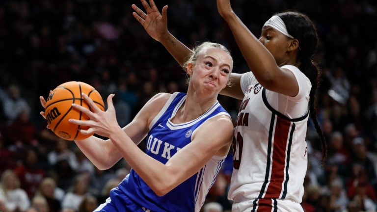 Duke forward Toby Fournier, left, drives into South Carolina forward Sania Feagin during the first half of an NCAA college basketball game in Columbia, S.C., Thursday, Dec. 5, 2024. (Nell Redmond/AP)