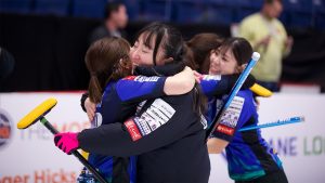 Team Fujisawa hug after winning their tiebreaker match at the WFG Masters on Jan. 18, 2025, in Guelph, Ont. (Anil Mungal/GSOC)