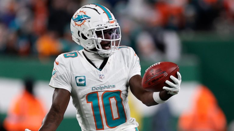 Miami Dolphins wide receiver Tyreek Hill (10) runs with the ball during an NFL football game against the New York Jets Sunday, Jan. 5, 2025, in East Rutherford, N.J. (Adam Hunger/AP)