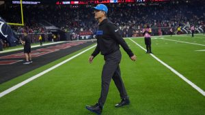 Los Angeles Chargers coach Jim Harbaugh leaves the field after an NFL wild-card playoff football game against the Houston Texans Saturday, Jan. 11, 2025, in Houston. The Texans won 32-12. (Ashley Landis/AP)