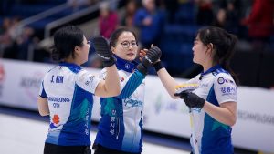 From left, Seon-yeong Kim, Eun-jung Kim and Cho-hi Kim celebrate after their win at the WFG Masters on Jan. 17, 2025, in Guelph, Ont. (Anil Mungal/GSOC)