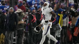 Baltimore Ravens quarterback Lamar Jackson (8) jogs to the sidelines during the fourth quarter of an NFL divisional playoff football game against the Buffalo Bills, Sunday, Jan. 19, 2025, in Orchard Park, N.Y. (Frank Franklin II/AP)