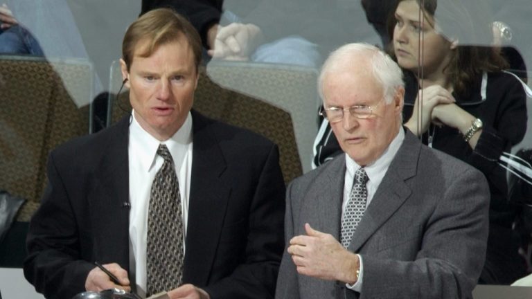 Calgary Flames’ Al MacNeil, right, confers with his assistant Jamie Hislop, left, in the first period of a game against the Colorado Avalanche in the Pepsi Center in Denver on Tuesday, Dec. 3, 2002. (David Zalubowski/AP)