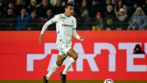 Marseille's Mason Greenwood runs with the ball during the French League One soccer match between Rennes and Marseille in Rennes, France, Saturday Jan. 11, 2025. (Mathieu Pattier/AP)