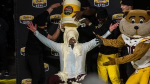 Minnesota head coach P.J. Fleck, center, receives the mayo dump after winning the Duke's Mayo Bowl NCAA college football game against Virginia Tech, Friday, Jan. 3, 2025, in Charlotte, N.C. (Robert Simmons/AP)