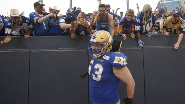 Winnipeg Blue Bombers' Patrick Neufeld interacts with fans during first half CFL action against the Ottawa Redblacks in Winnipeg, Friday, June 10, 2022. (John Woods/CP)