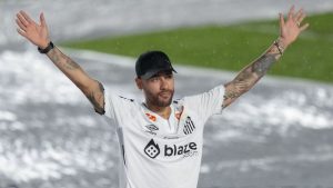 Brazilian soccer player Neymar waves to fans during his presentation ceremony after signing a six-month contract with Santos FC at Vila Belmiro Stadium in Santos, Brazil, Friday, Jan. 31, 2025. (Andre Penner/AP)
