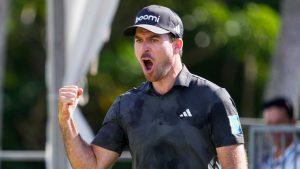 Nick Taylor, of Canada, celebrates after making a shot on the 18th green during the final round of the Sony Open golf event. (Matt York/AP)