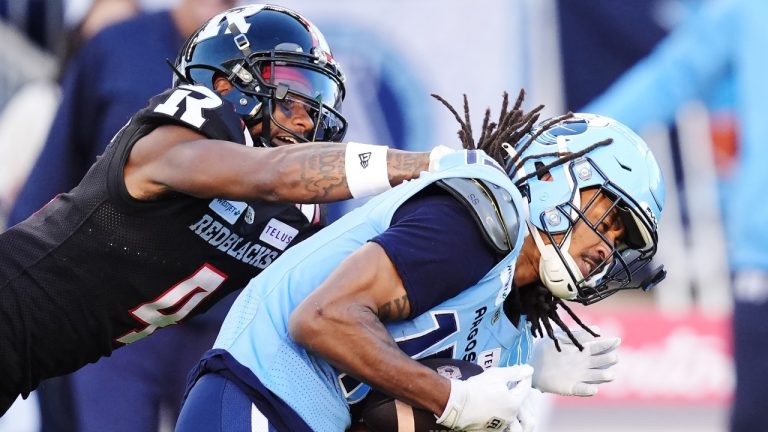 Toronto Argonauts wide receiver Makai Polk (right) makes a catch as Ottawa Redblacks defensive back Monshadrik Hunter (4) defends during second half Eastern Conference semifinal CFL football action in Toronto on Saturday, November 2, 2024. (Frank Gunn/THE CANADIAN PRESS)