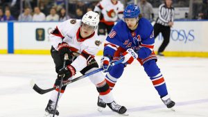 Ottawa Senators center Tim Stützle (18) plays the puck against New York Rangers left wing Artemi Panarin (10) during the second period of an NHL hockey game, Tuesday, Jan. 21, 2025, in New York. (Noah K. Murray/AP)