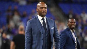 Analyst Louis Riddick walks on the field during pre-game warm-ups before an NFL football game between the Baltimore Ravens and the Indianapolis Colts, on Oct. 11, 2021, in Baltimore, Md. (Terrance Williams/AP)