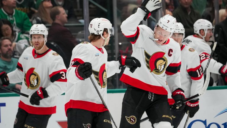 Ottawa Senators center Ridly Greig, center left, is congratulated by left wing Brady Tkachuk, center right, after scoring a goal against the Dallas Stars during the first period of an NHL hokey game, Thursday, Jan. 2, 2025, in Dallas. (Julio Cortez/AP)