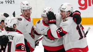 Ottawa Senators' Shane Pinto, right, celebrates his first of two goals during the first period of an NHL hockey game against the Pittsburgh Penguins in Pittsburgh, Saturday, Jan. 11, 2025. (Gene J. Puskar/AP)