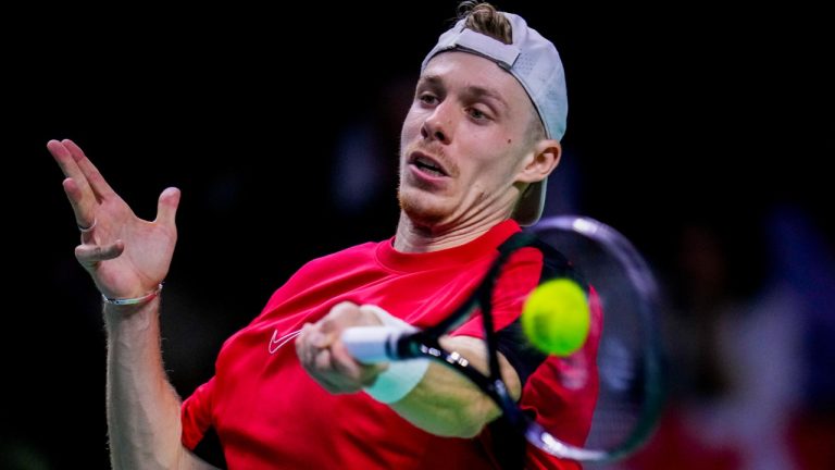 Canada's Denis Shapovalov returns the ball against Germany's Jan-Lennard Struff during a Davis Cup quarterfinal match at the Martin Carpena Sports Hall, in Malaga, southern Spain, on Wednesday, Nov. 20, 2024. (Manu Fernandez/AP)