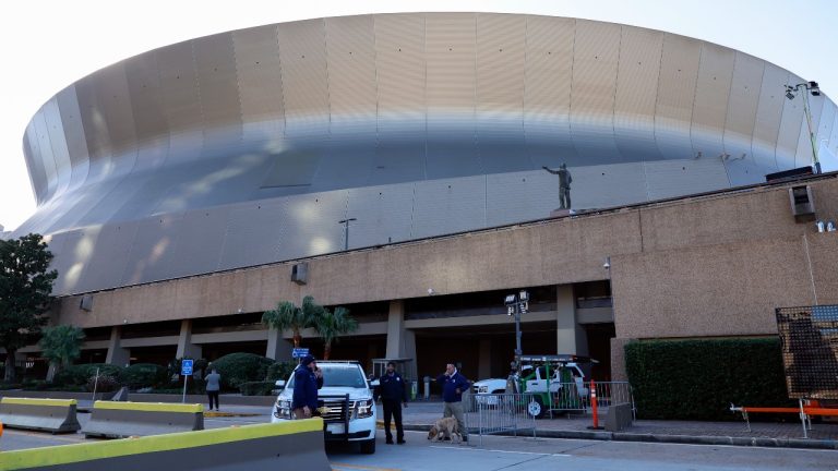 Security and bomb sniffing dogs check vehicles as they enter the Superdome parking garage ahead of the Sugar Bowl NCAA College Football Playoff game, Thursday, Jan. 2, 2025, in New Orleans. (Butch Dill/AP Photo)