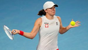 Poland's Iga Swiatek hits a forehand to Coco Gauff of the U.S. in their final match at the United Cup tennis tournament in Sydney, Australia, Sunday, Jan. 5, 2025. (Rick Rycroft/AP)