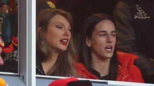 Taylor Swift watches from a suite with basketball player Caitlin Clark, right, during the second half of an NFL football AFC divisional playoff game Saturday, Jan. 18, 2025, in Kansas City, Mo. (Travis Heying/AP Photo)