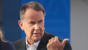 Television presenter Tony Jones during a live cross at Melbourne Park venue for the Australian Open tennis championship in Melbourne, Australia, Monday, Jan. 20, 2025. (Mark Baker/AP)