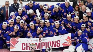 United States players celebrate their 4-3 overtime win over Finland in the IIHF World Junior Hockey Championship gold medal game, in Ottawa, Sunday, Jan. 5, 2025. (Adrian Wyld/CP)