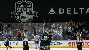 Utah Hockey Club players, centre, celebrate after goal against the New York Islanders during the second period of an NHL hockey game Saturday, Jan. 11, 2025, in Salt Lake City. (Melissa Majchrzak/AP)