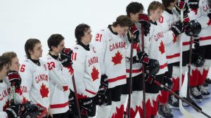 Canada captain Brayden Yager (11) stands on the blueline with teammates after losing 4-3 to Czechia in the IIHF World Junior Hockey Championship quarterfinal, in Ottawa, Thursday, Jan. 2, 2025. (Adrian Wyld/CP)