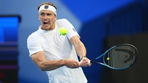 Alexander Zverev of Germany hits a return shot to Zhizhen Zhang of China during their United Cup tennis match in Perth, Australia, Monday, Dec. 30, 2024. (Trevor Collens/AP)