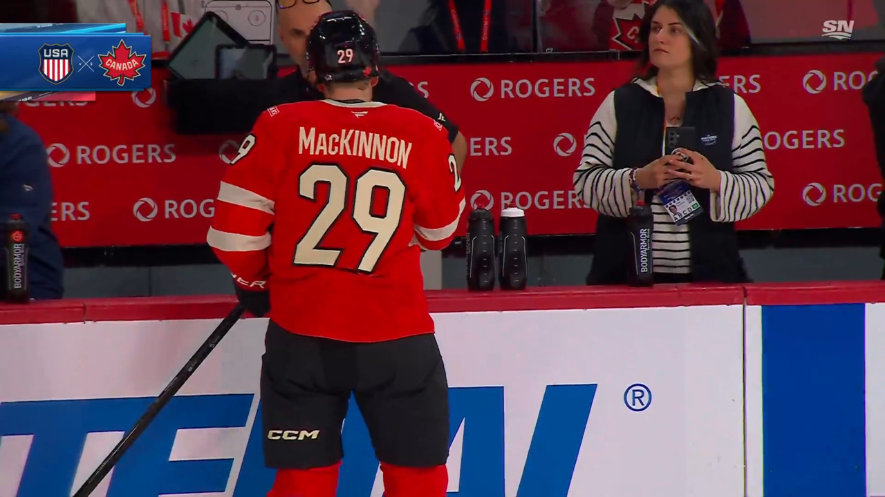 Canada’s MacKinnon takes puck to face during pre-game warmup