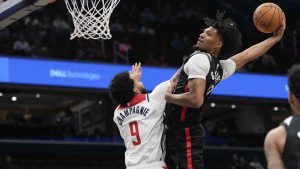 Portland Trail Blazers guard Shaedon Sharpe (17) dunks against Washington Wizards forward Justin Champagnie (9) during the first half of an NBA basketball game, Wednesday, Feb. 26, 2025, in Washington. (Jess Rapfogel/AP)