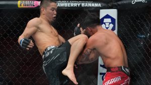 Asu Almabayev knees his opponent during a UFC mixed martial arts bout. (Wilfredo Lee/AP)