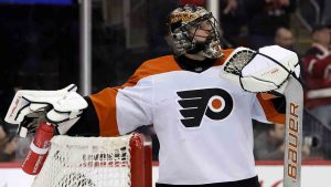 Philadelphia Flyers goaltender Samuel Ersson reacts after giving up a goal to New Jersey Devils left wing Ondrej Palat during the second period of an NHL hockey game Wednesday, Jan. 29, 2025, in Newark, N.J. (Adam Hunger/AP)