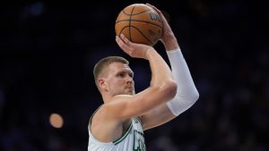 Boston Celtics' Kristaps Porzingis plays during an NBA basketball game, Thursday, Feb. 20, 2025, in Philadelphia. (AP Photo/Matt Slocum)