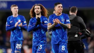 Chelsea players, from right, Enzo Fernandez, Marc Cucurella and Cole Palmer celebratethe Premier League soccer match against Southampton, Tuesday, Feb. 25, 2025, at Stamford Bridge in London. (John Walton/PA via AP)