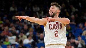 Cleveland Cavaliers guard Ty Jerome (2) points to the team bench after sinking a 3-point shot against the Orlando Magic during the second half of an NBA basketball game, Tuesday, Feb. 25, 2025, in Orlando, Fla. (John Raoux/AP)