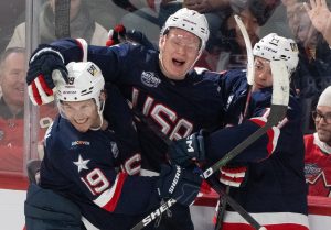 United States' Brady Tkachuk (7) celebrates his goal over Finland with teammates Matthew Tkachuk (19) and Brock Faber (14) during third period 4 Nations Face-Off hockey action in Montreal on Thursday, Feb. 13, 2025. THE CANADIAN PRESS/Christinne Muschi